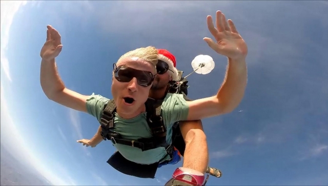  With the parachute opening 